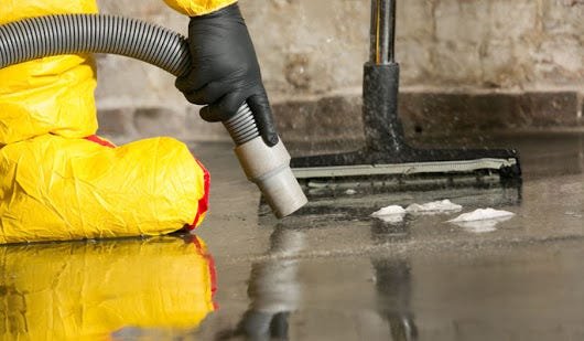 Emergency water removal service extracting water from flooded home