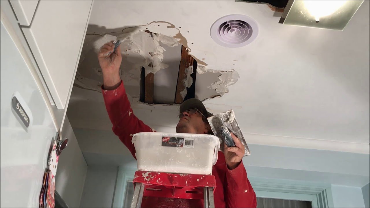 Water stain and ceiling water damage repair in residential home interior