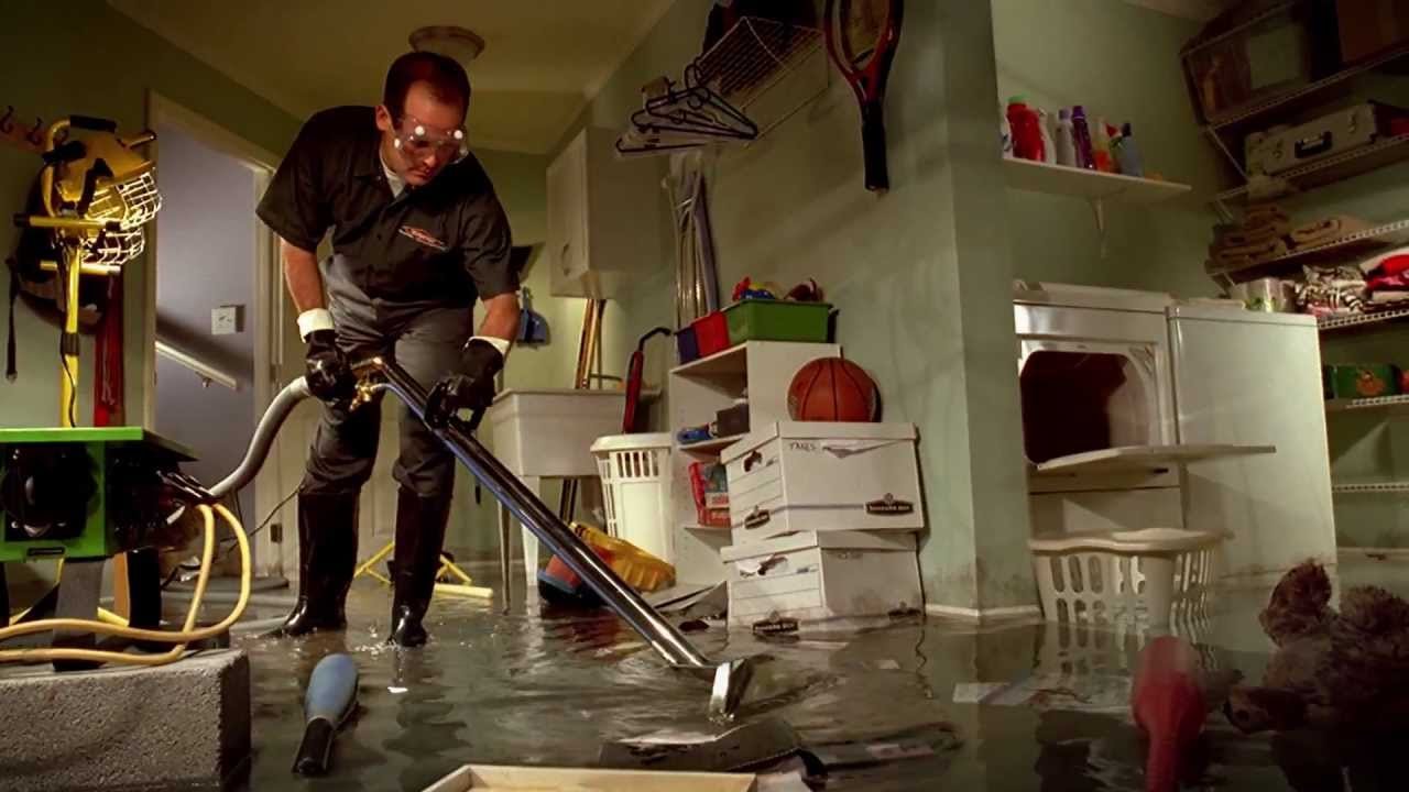 Emergency water removal after burst pipe in residential property