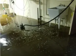 Emergency water damage restoration process showing standing water removal and mitigation inside a commercial property.